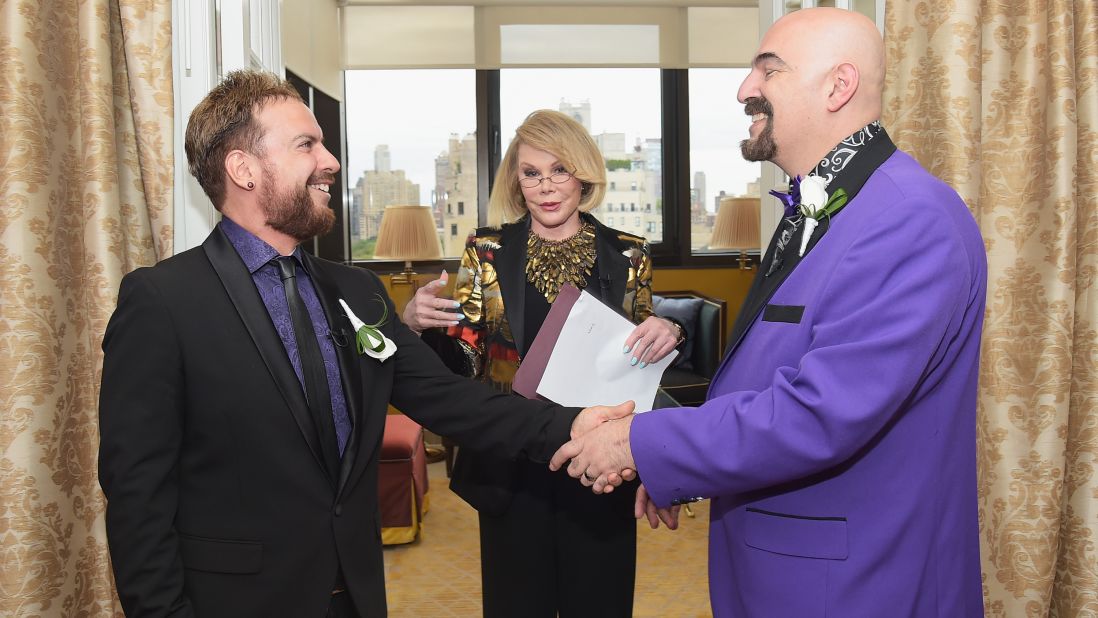 Rivers officiates the wedding of William "Jed" Ryan, left, and Joseph Aiello at the Plaza Athenee on August 15 in New York.