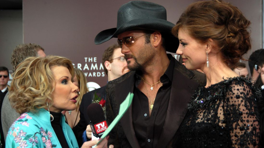 Rivers talks with Tim McGraw and his wife, Faith Hill, at the Grammys in 2005.
