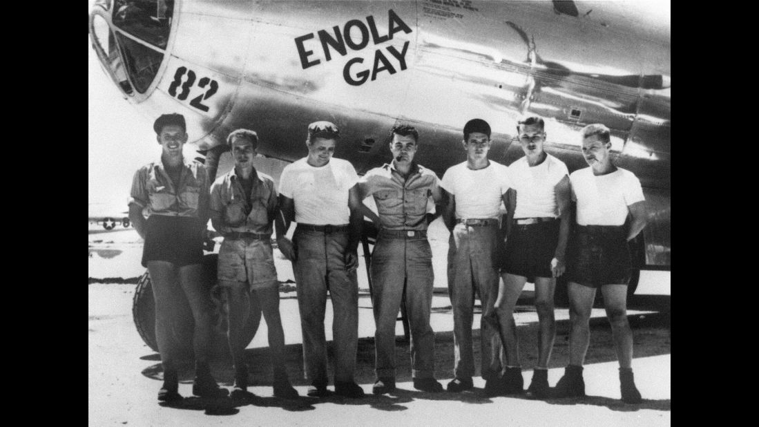 Col. Paul W. Tibbets Jr., center, stands with the ground crew of the B-29 bomber "Enola Gay," which Tibbets piloted on August 6, 1945. The atomic bomb dropped on Hiroshima, Japan, that day killed an estimated 130,000 people. 
