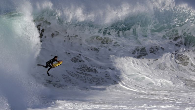 A bodyboarder rides a wave at the wedge in Newport Beach, California, on Wednesday, August 27. Southern California beachgoers experienced <a href="http://www.cnn.com/video/data/2.0/video/us/2014/08/27/malibu-big-waves-orig-cfb.cnn.html">higher than normal surf</a>, brought on by Hurricane Marie off the coast of Mexico.