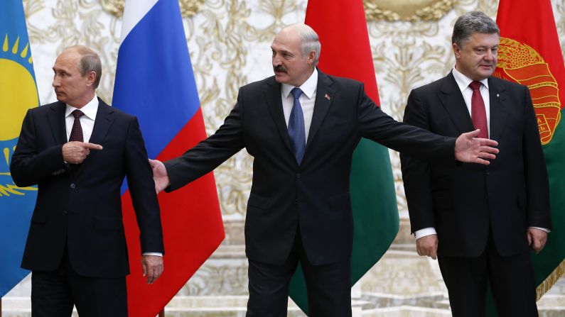 From left, Russian President Vladimir Putin, Belarusian President Alexander Lukashenko and Ukrainian President Petro Poroshenko react while posing for a picture during their meeting in Minsk, Belarus, on Tuesday, August 26. Ukraine's President called for "resolute actions that will bring peace" to his country.