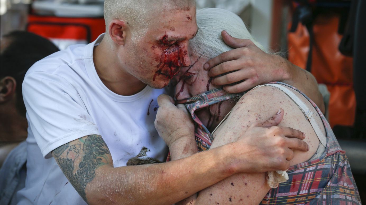 A man comforts a woman after they were both wounded by what locals say was recent shelling by Ukrainian forces in Donetsk on Saturday, August 23. <a href="http://www.cnn.com/2014/08/07/europe/gallery/ukraine-crisis/index.html">Ongoing clashes</a> between Ukrainian government troops and pro-Russian rebels have left more than 2,000 people dead since mid-April, according to estimates from U.N. officials.
