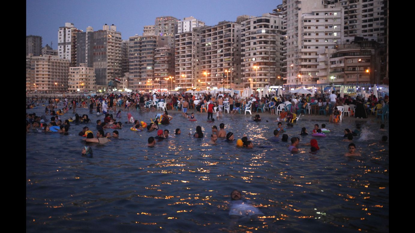 People relax at a public beach in Alexandria, Egypt, on Saturday, August 23.