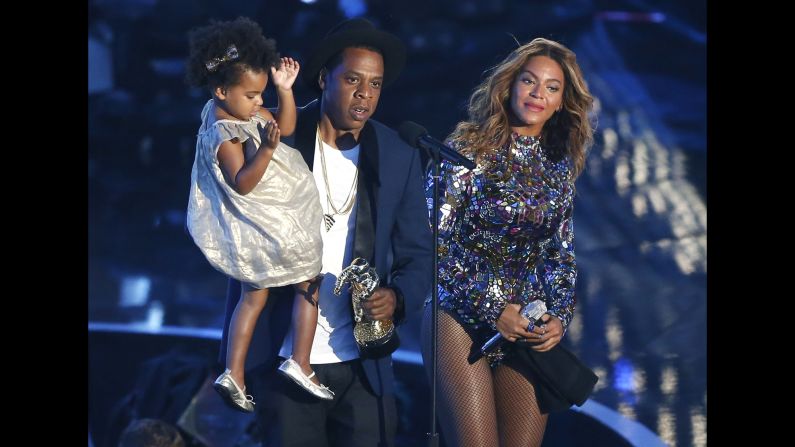 Jay-Z presents the Video Vanguard Award to Beyonce as he holds their daughter, Blue Ivy, during the <a href="http://www.cnn.com/2014/08/25/showbiz/gallery/mtv-vmas-2014/index.html">2014 MTV Video Music Awards</a> in Inglewood, California, on Sunday, August 24.