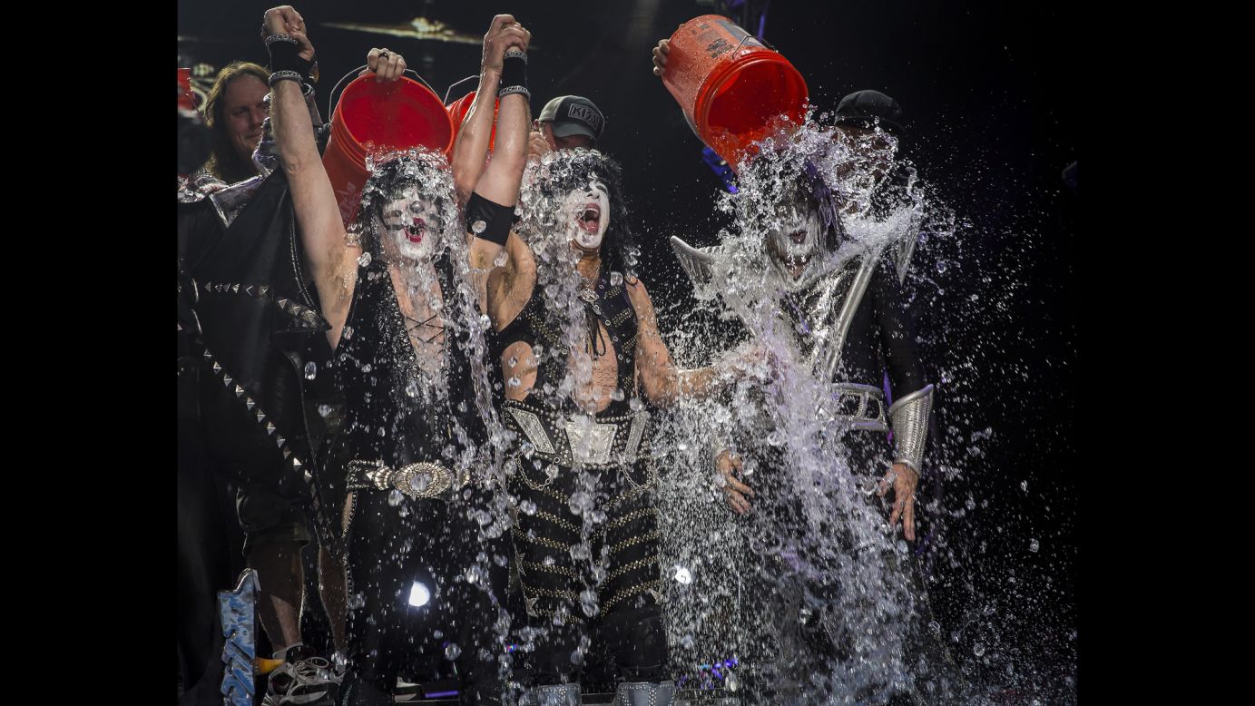 Eric Singer, Paul Stanley and Tommy Thayer of the band KISS participate in the ALS Ice Bucket Challenge on stage in Noblesville, Indiana, on Friday, August 22.