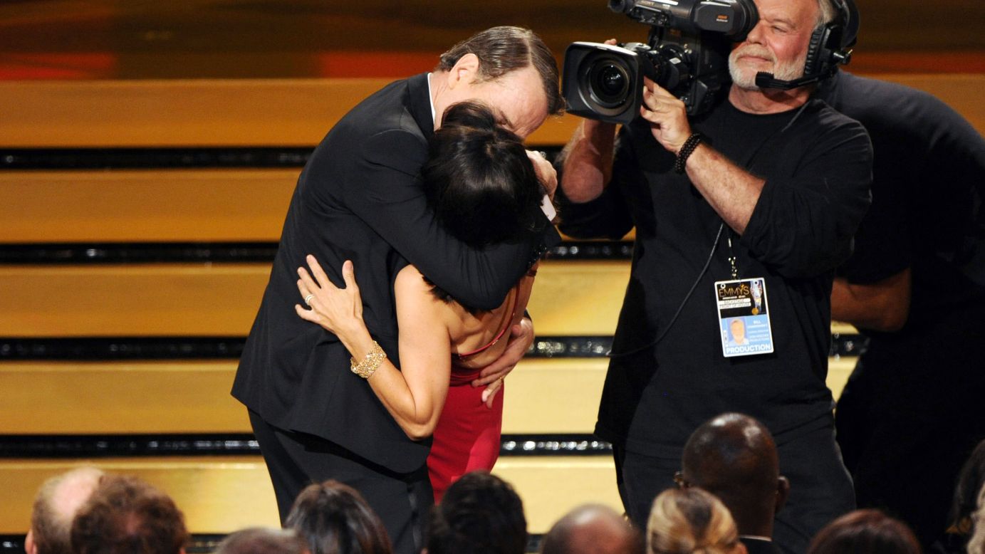 Bryan Cranston kisses Julia Louis-Dreyfus as she accepts the award for outstanding lead actress in a comedy series for her work on "Veep" at the <a href="http://www.cnn.com/2014/08/26/showbiz/gallery/emmy-moments-2014/index.html">66th Primetime Emmy Awards</a> in Los Angeles on Monday, August 25. "It was pretty good," Louis-Dreyfus later said backstage. "He went for it. He goes for it in everything he does."