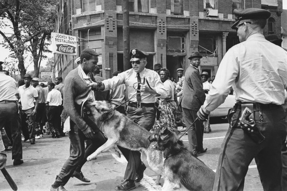 A 17-year-old civil rights demonstrator, defying an anti-parade ordinance in Birmingham, Alabama, is attacked by a police dog on May 3, 1963.  