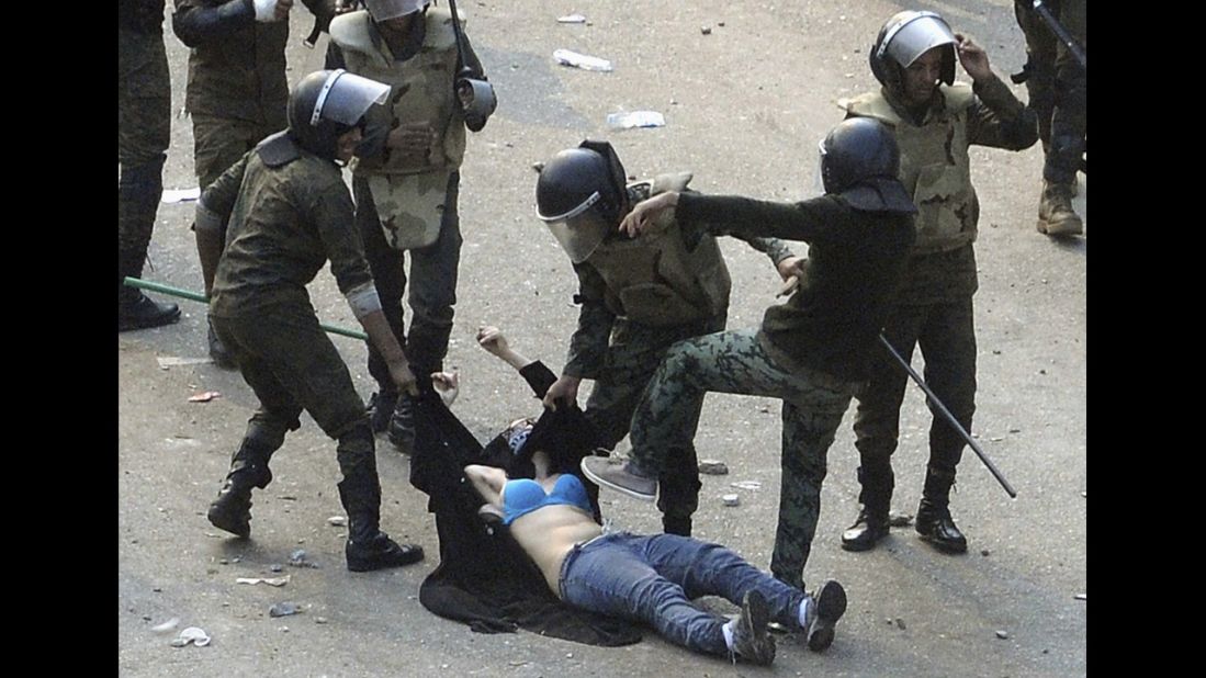 Egyptian army soldiers arrest a female protester during clashes at Tahrir Square in Cairo on December 17, 2011. On January 25, people took to the streets in demonstrations against corruption and failing economic policies. From the beginning, the revolution in Egypt was propelled by the use of social media. The events in Egypt served as a flash poin