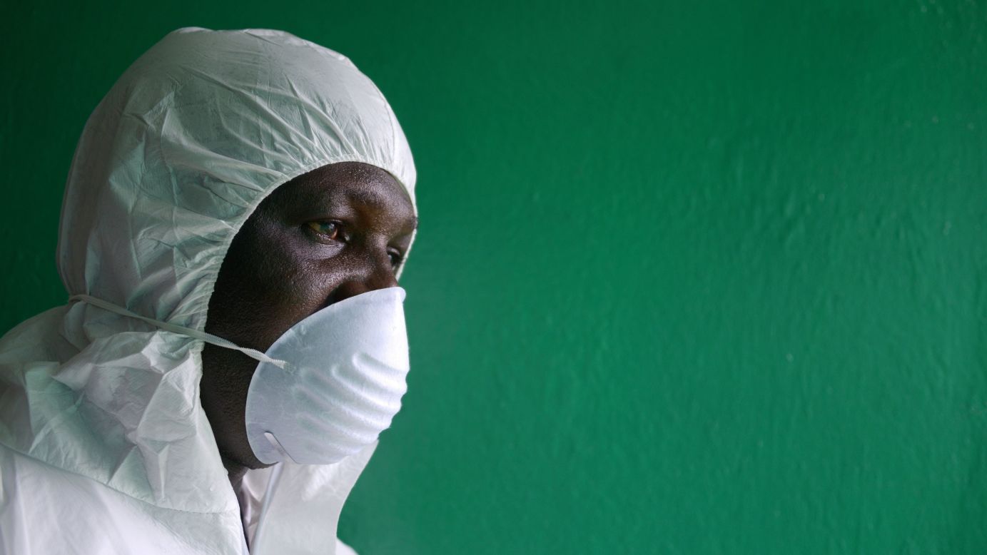 A health worker wearing a protective suit conducts an Ebola prevention drill at the port in Monrovia on August 29, 2014.  