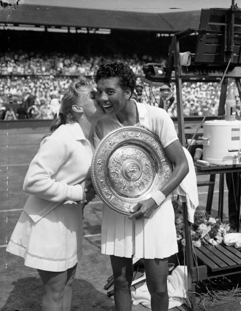 Gibson (right) receives a kiss from compatriot Darlene Hard, who she beat to become the first black woman to win the Wimbledon title in 1957.