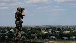 A Ukrainian loyalist fighter from the Azov Battalion stand guard on a hill on the outskirts of Mariupol on August 30, 2014. Pro-Russian rebels in east Ukraine warned on Saturday that they will launch a fresh offensive against government troops, days after seizing swathes of territory.  AFP PHOTO/ FRANCISCO LEONG        (Photo credit should read FRANCISCO LEONG/AFP/Getty Images)