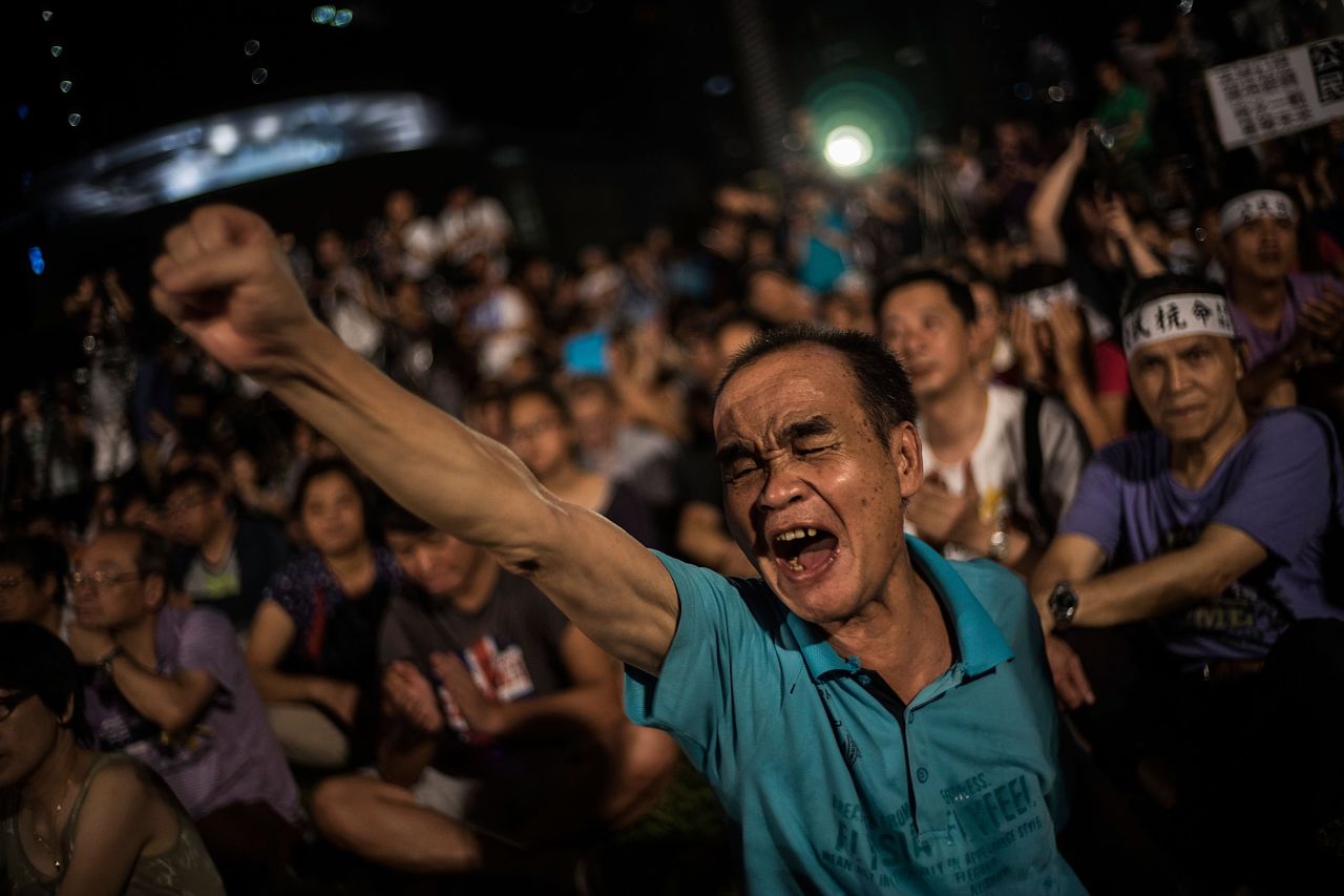 Hong Kong protesters denounce the Chinese government on August 31, 2014, after Beijing announced candidates for Hong Kong's next leader must be approved by a Beijing-backed committee.