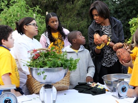 Youngsters weigh into the South Lawn harvesting with Chef Comerford and the First Lady. - (Getty Images)