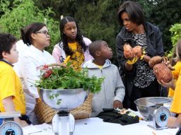 Youngsters weigh into the South Lawn harvesting with Chef Comerford and the First Lady. - (Getty Images)