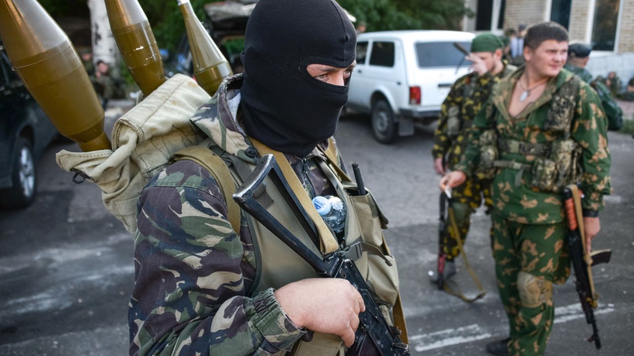 Pro-Russian rebels prepare arms for the the assault on the positions of Ukrainian army in Donetsk airport, eastern Ukraine, Sunday, Aug. 31, 2014.