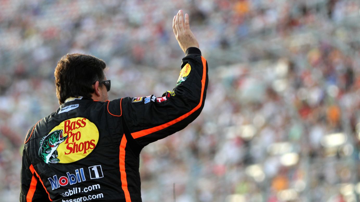 NASCAR driver Tony Stewart waves to the crowd at Atlanta Motor Speedway prior to the Sprint Cup race there on Sunday, August 31. It was <a href="http://www.cnn.com/2014/09/01/us/tony-stewart-return/index.html">Stewart's first race</a> since August 9, when the car he was driving fatally struck Kevin Ward Jr. at a New York dirt track. 