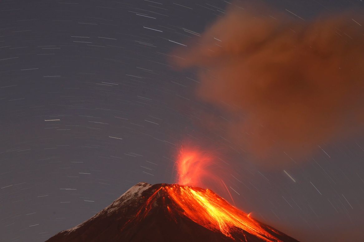 SEPTEMBER 1 - BANOS, ECUADOR: The Tungurahua volcano spews ash and stones during an eruption on August 31. <a href="http://cnn.com/2011/WORLD/americas/04/26/ecuador.volcano/">Tungurahua, which translates as "Throat of fire" in the native Quechua language, has erupted periodically since 1999. </a>