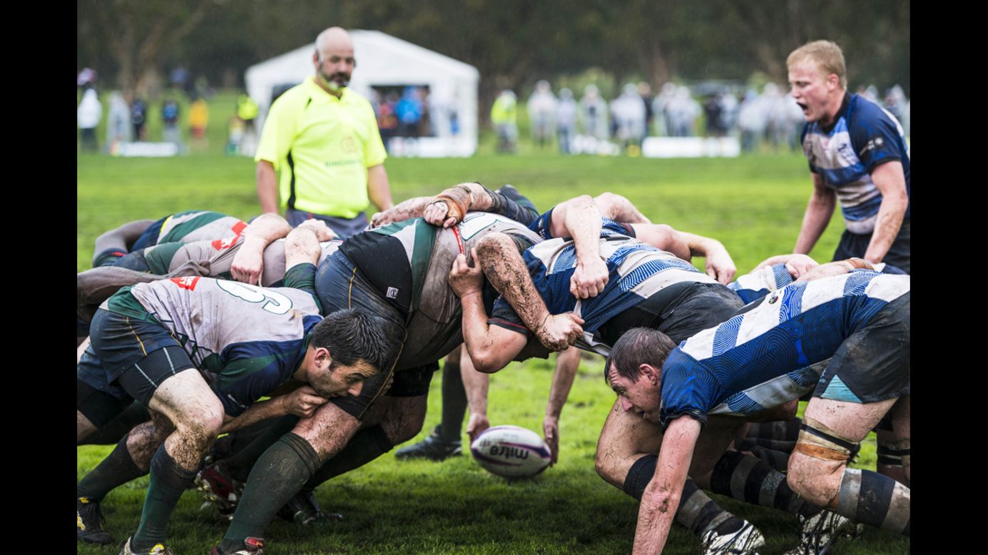 A rugby ball is held near a scrum during a Bingham Cup match in Sydney on Friday, August 29. The Bingham Cup is an international tournament that promotes gay-inclusive rugby clubs.
