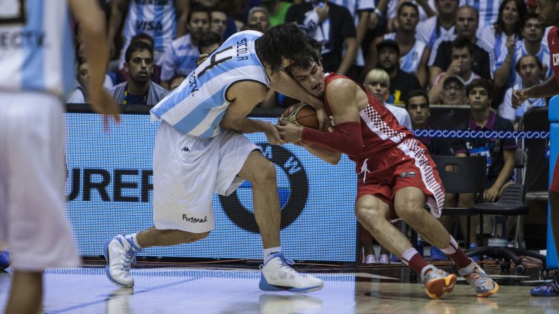 Argentina's Luis Scola and Croatia's Dario Saric wrestle for the ball during a FIBA World Cup game Sunday, August 31, in Seville, Spain. <a href="http://www.cnn.com/2014/08/25/worldsport/gallery/what-a-shot-0826/index.html">See 40 amazing sports photos from last week</a>