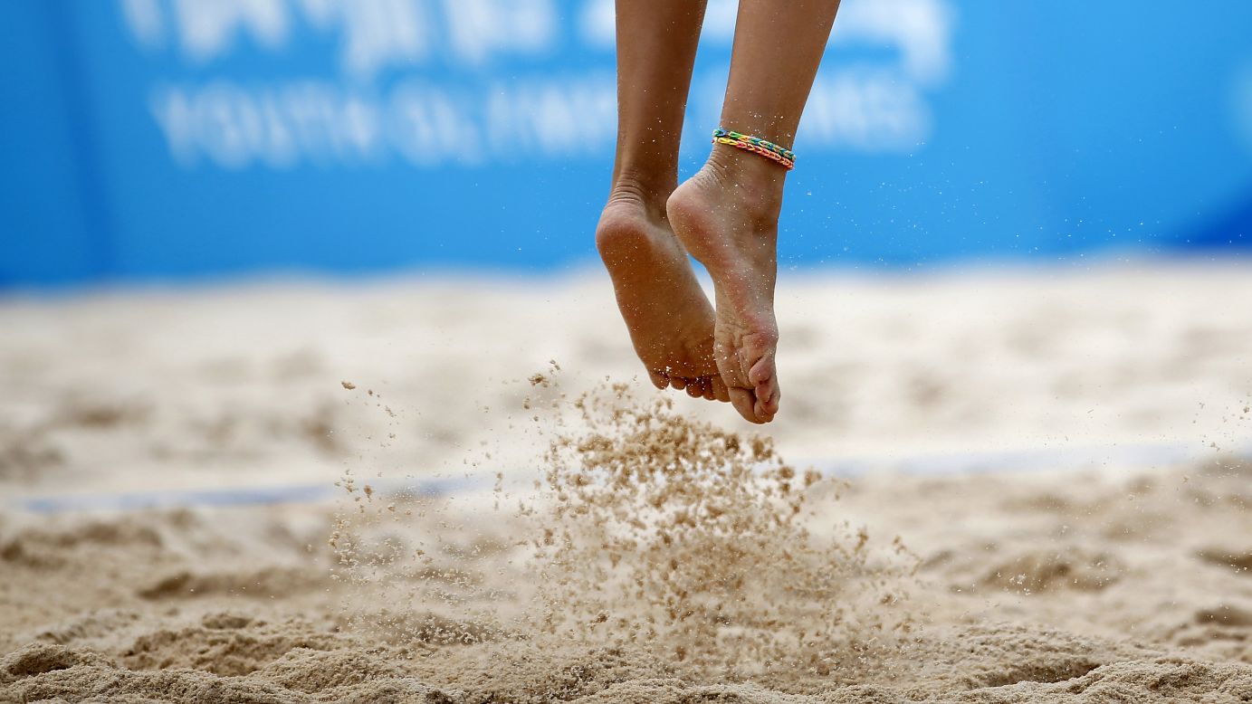 Russia's Nadezda Makroguzova jumps for a serve Tuesday, August 26, during a beach volleyball match at the Youth Olympic Games in Nanjing, China.
