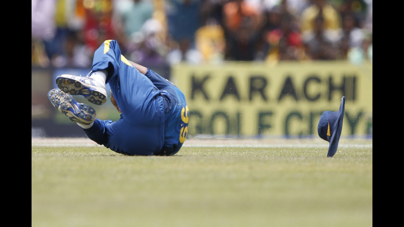 Sri Lankan cricketer Lasith Malinga dives for a catch during the One Day International match against Pakistan on Saturday, August 30.