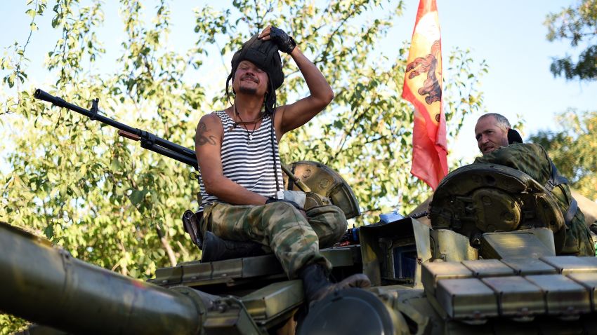 Pro-Russian fighters sit ontop of their T-64 tank in Starobesheve, southeast of Donetsk, on August 31, 2014.