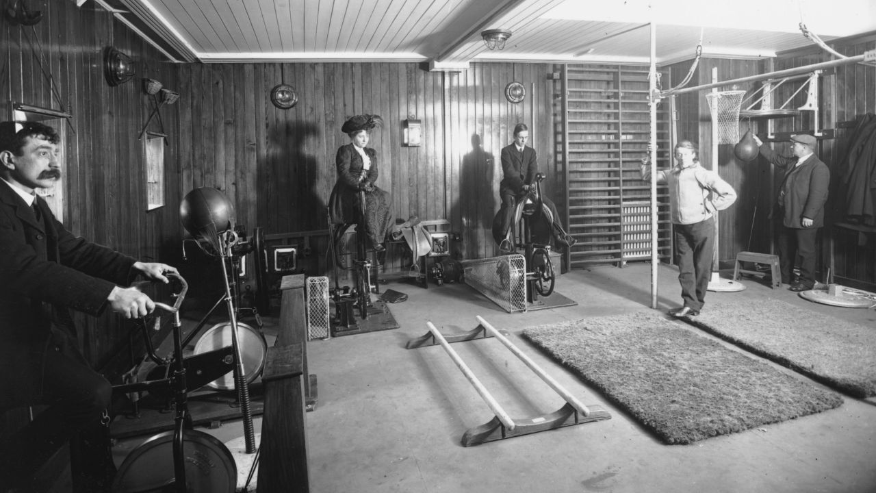 Indoor skydiving is one of the shinier new cruising activities, but passengers have long entertained themselves at sea with fitness and recreation. These cruisers ride exercise bikes while wearing day clothes aboard a Cunard cruise liner in 1911. 