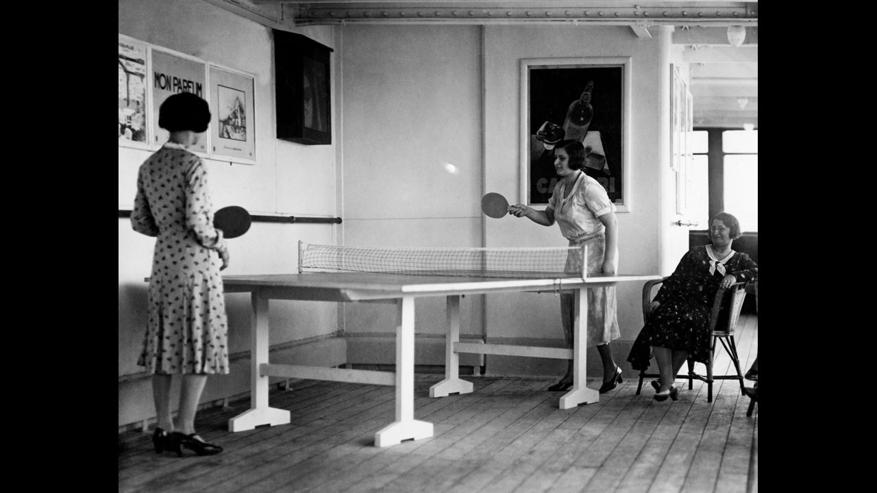 A 1930 game of table tennis unfolds aboard MS Giulio Cesare. 