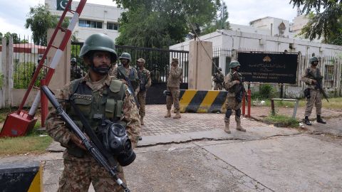 Soldiers stand guard outside the headquarters of state-owned Pakistani Television (PTV) on September 1.