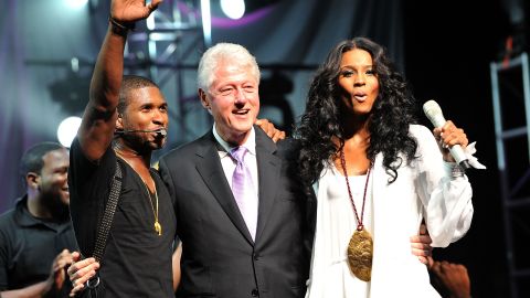 Clinton joins singers Usher and Ciara at the New Look Foundation's First Annual World Leadership Awards in 2010 in Atlanta.