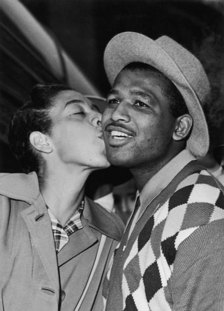 Gibson greets Sugar Ray Robinson on his arrival in London in 1957. The American boxing legend and his wife were early benefactors in Gibson's life, helping fund her tennis career as a teenager.