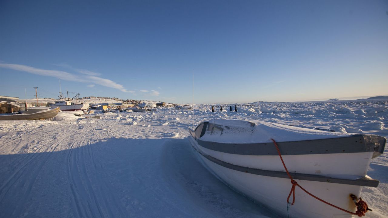 A boat sits along the frozen shoreline in Iqaluit, Canada. This kind of weather has made it an ideal spot to test aircraft.