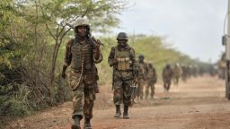 This handout picture released by the African Union-United Nations Information Support Team on August 30, 2014 shows Ugandan soldiers, part of the African Union Mission in Somalia, marching towards the town of Golweyn in Somalia's Lower Shabelle region on August 30, 2014, controlled by Shebab fighters. African Union forces claimed to have liberated a former Shebab stronghold in Somalia on August 30, 2014 as part of a joint offensive with government troops aimed at capturing key ports from the Islamist fighters. AFP PHOTO/ AMISOM HANDOUT/ TOBIN JONESTOBIN JONES/AFP/Getty Images