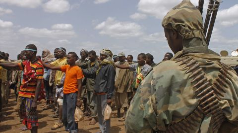 [File] Photo taken on September 22, 2012 shows members of  Al-Shabaab giving themselves up to AU peacekeepers in Somalia.