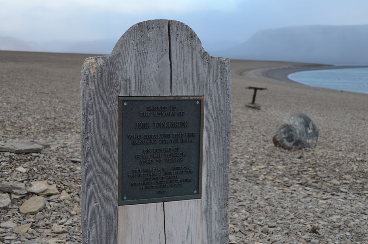 Reminders of early, ill-fated expeditions to traverse the Northwest Passage can still be found on the islands of the high Arctic. This replica sign commemorates a man who perished during Englishman John Franklin's 1845 expedition.