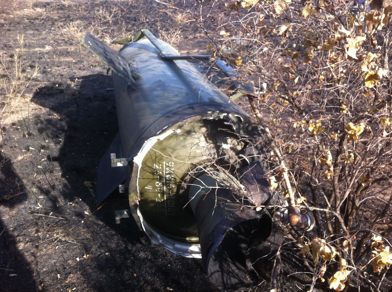 The rocket motor section of a Russian-made SS-21 'Scarab' ballistic missile, found by the CNN team in a field south of Ilovaisk.