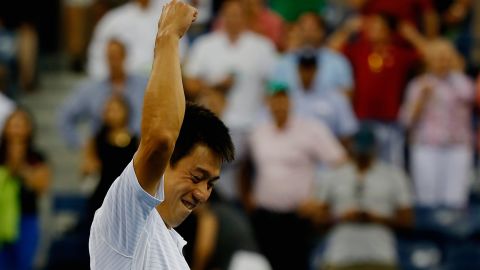 Kei Nishikori of Japan celebrates after defeating Stan Wawrinka of Switzerland in their men's singles quarterfinal match. 