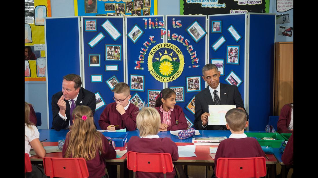 Obama and Cameron meet with schoolchildren in Newport on September 4 before attending the NATO summit.