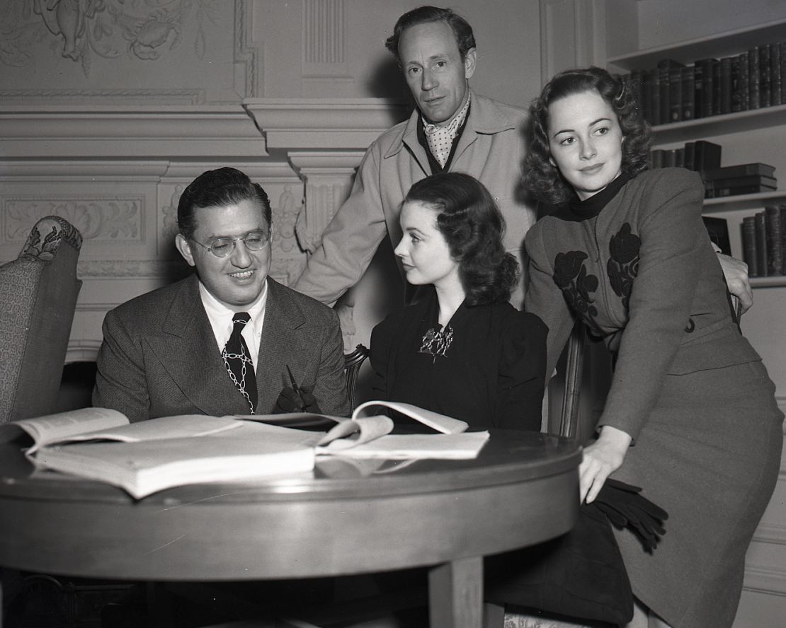 Producer David O. Selznick, left, reveals the casting of Vivien Leigh, Leslie Howard and Olivia de Havilland in January 1939.