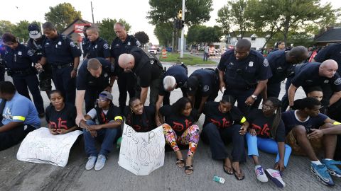 Police handcuff protesters blocking traffic in Detroit on September 4.