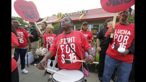 Carmalita Johnson drums as protesters rally outside a McDonald's on Chicago's South Side on September 4.