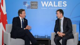 Caption:NEWPORT, WALES - SEPTEMBER 3: British Prime Minister David Cameron (L) meets with NATO Secretary General Anders Fogh Rasmussen at the Celtic Manor Resort on September 3, 2014 in Newport, Wales, United Kingdom. Some 67 world leaders will be attending the NATO summit at Celtic Manor September 4-5. (Photo by Leon Neal - WPA Pool/Getty Images)