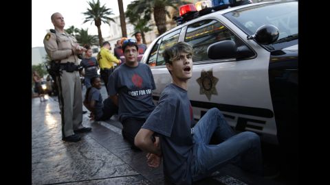 Handcuffed protesters chant for increased wages in Las Vegas on September 4.