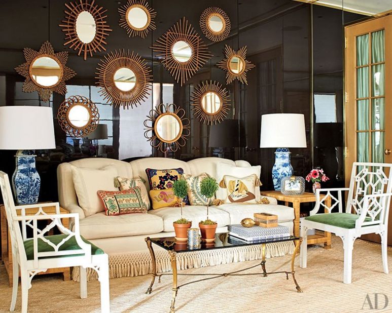 Another constellation of mirrors shines against a brown-lacquered wall in the en suite waiting room, where a shapely sofa is piled with needlepoint pillows that once belonged to Burch's parents. <a href="http://www.architecturaldigest.com/decor/2014-09/tory-burch-manhattan-office-slideshow?mbid=synd_cnn" target="_blank" target="_blank">See more photos on ArchDigest.com</a>