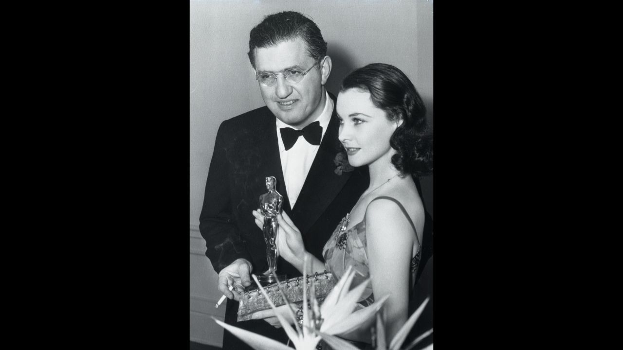 Leigh celebrates winning the best actress Oscar with Selznick at the Academy Awards ceremony in 1940. "Gone With the Wind" also took home top honors for best picture and director, and the producer received the Irving G. Thalberg Memorial Award for career achievement. "Selznick was the primary artistic influence on the film. He really pushed everyone," says Wilson, the exhibition curator. "His hand touched everything."