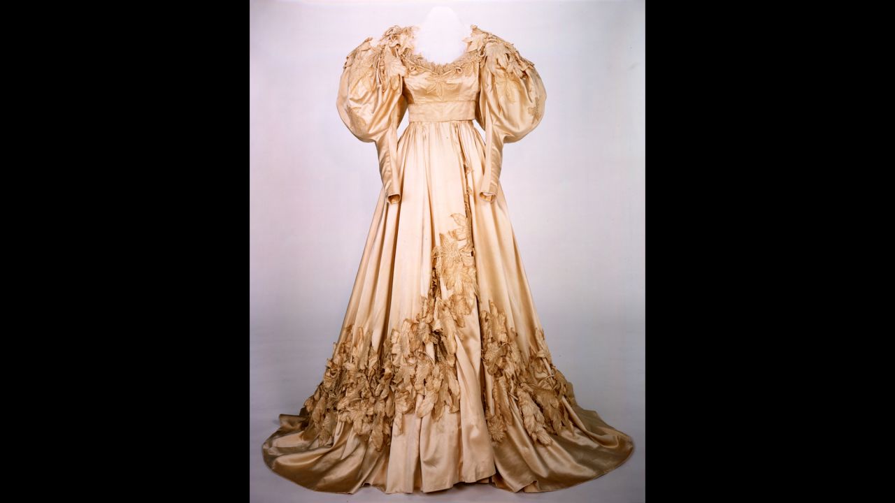 Scarlett's wedding gown is one of two replicas appearing in the exhibition. This dress and a blue velvet peignoir the character wears in her daughter's death scene were deemed too delicate and fragile for conservation efforts. In the film, the wedding dress appears bulky and ill-fitting on Scarlett, who has rushed into marriage with Charles Hamilton, borrowing her mother's gown.