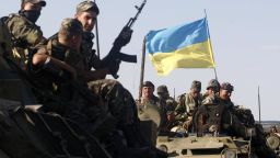 Ukrainian soldiers sit on top of an APC in a column of Ukrainian tanks which travels in Donetsk region on September 3, 2014. Beleaguered Ukrainian President Petro Poroshenko announced on September 3 that he and his Russian counterpart Vladimir Putin had agreed a surprise truce in Ukraine's four-month war with pro-Moscow rebels. But the Kremlin immediately denied any formal agreement and stressed that Russia played no role in the conflict despite Western claims that it has orchestrated the insurgency tearing apart the ex-Soviet state. AFP PHOTO / ANATOLII STEPANOVANATOLII STEPANOV/AFP/Getty Images