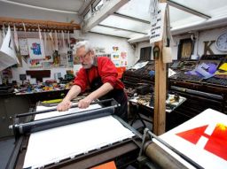 Alan Kitching at work on his Monotype prints in his London workshop. - (Courtesy Phil Sayer)