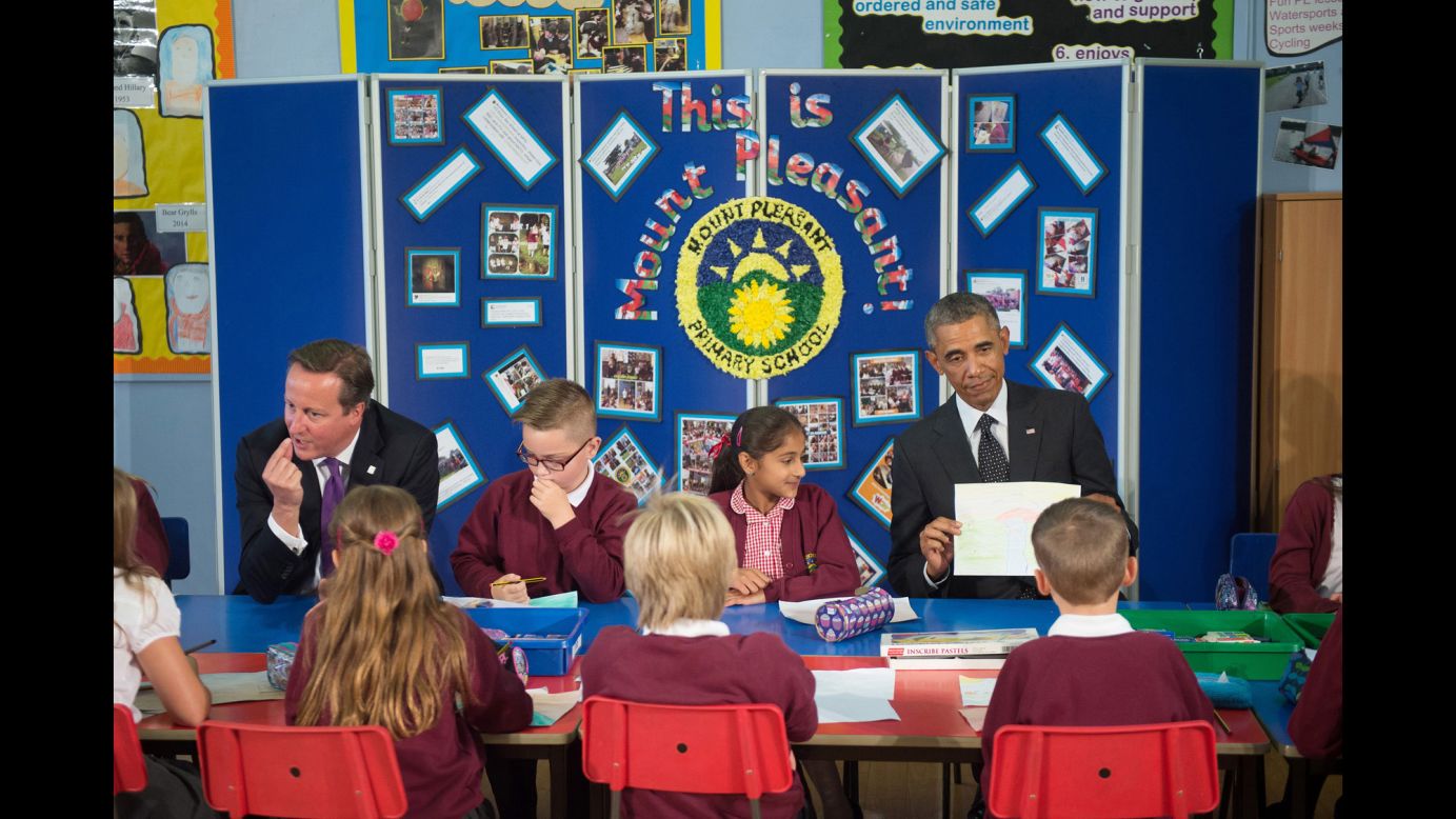 U.S. President Barack Obama, right, and British Prime Minister David Cameron meet with schoolchildren in Newport, Wales, before attending a NATO summit on Thursday, September 4. The two-day summit is billed as the most important gathering of NATO leaders in more than a decade. <a href="http://www.cnn.com/2014/09/03/politics/gallery/obama-europe-september/index.html">See more photos from Obama's trip to Europe</a>