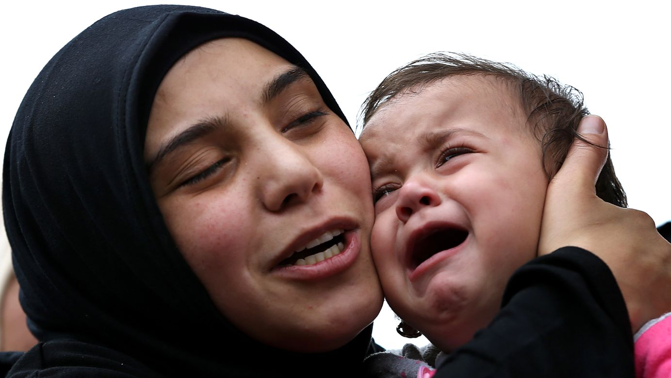 Ragheda, the wife of Lebanese soldier Ali Sayid, holds their 10-month-old daughter, Rahaf, during his funeral in Fnaydek, Lebanon, on Wednesday, September 3. Sayid was beheaded by Islamic militants who overran the Lebanese town of Arsal for several days last month. Arsal is near the Syrian border.